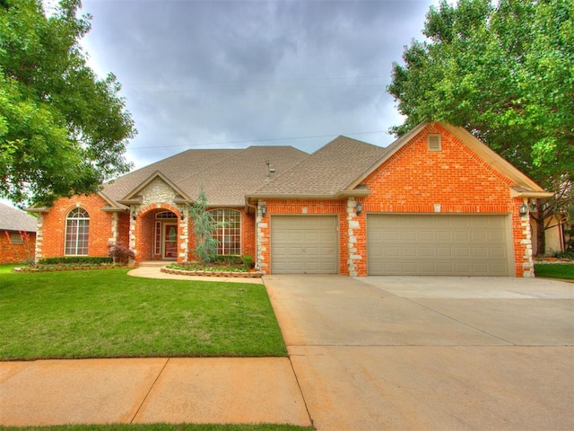 5608 NW 103rd St, Oklahoma City, OK 73162 - traditional-style home featuring brick siding, a garage, a front lawn, concrete driveway, and roof with shingles