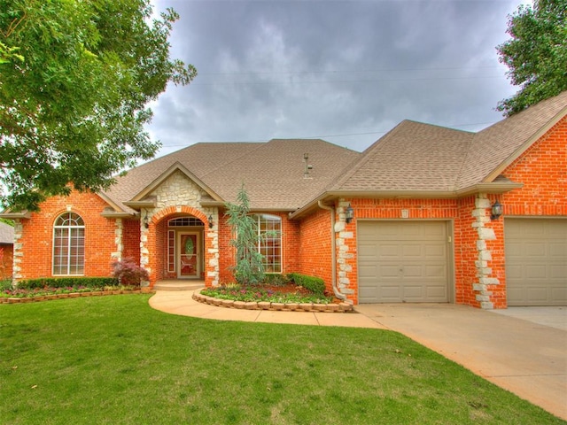 5608 NW 103rd St, Oklahoma City, OK 73162 - traditional home featuring an attached garage, roof with shingles, a front yard, concrete driveway, and brick siding