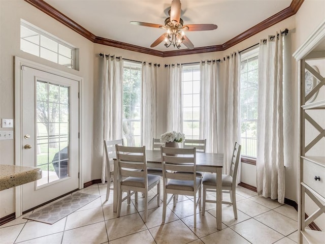 5608 NW 103rd St, Oklahoma City, OK 73162 - dining space featuring ceiling fan, light tile patterned flooring, crown molding, and baseboards