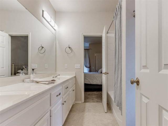 5608 NW 103rd St, Oklahoma City, OK 73162 - ensuite bathroom featuring double vanity, shower / tub combo with curtain, and baseboards
