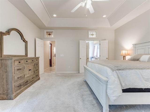 5608 NW 103rd St, Oklahoma City, OK 73162 - bedroom featuring light colored carpet, a tray ceiling, recessed lighting, baseboards, and ceiling fan