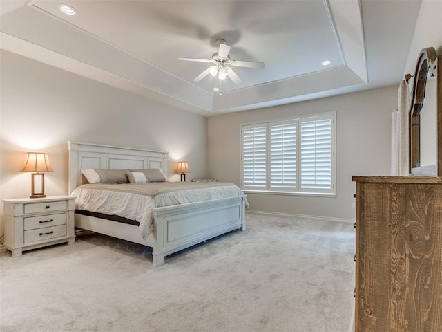 5608 NW 103rd St, Oklahoma City, OK 73162 - bedroom featuring a tray ceiling, light carpet, recessed lighting, baseboards, and a ceiling fan