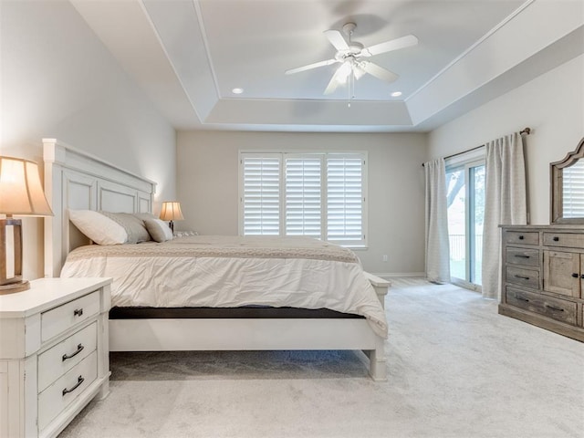 5608 NW 103rd St, Oklahoma City, OK 73162 - bedroom featuring light carpet, a raised ceiling, access to exterior, and ceiling fan