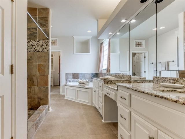 5608 NW 103rd St, Oklahoma City, OK 73162 - full bathroom featuring a shower stall, double vanity, tile patterned floors, recessed lighting, and a garden tub