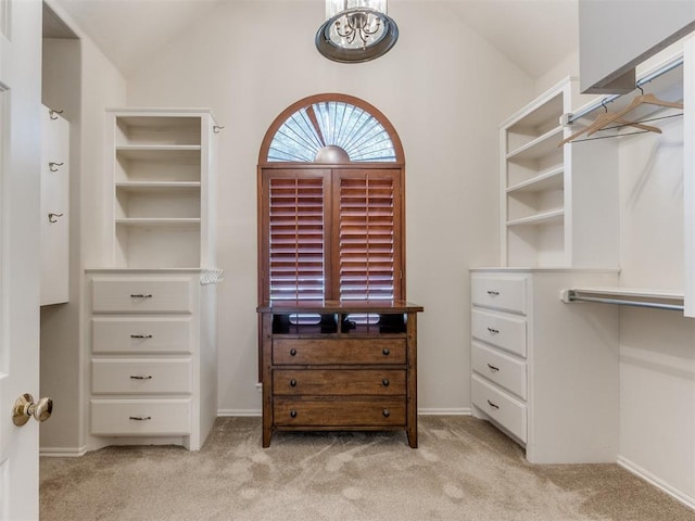 5608 NW 103rd St, Oklahoma City, OK 73162 - spacious closet with light carpet, vaulted ceiling, and a chandelier