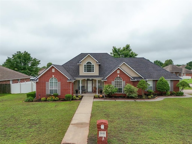 1401 Berkshire Pl, Shawnee, OK 74804 - traditional-style home featuring brick siding, a porch, and a shingled roof