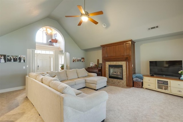 1401 Berkshire Pl, Shawnee, OK 74804 - living area featuring light colored carpet, high vaulted ceiling, ceiling fan, and a tile fireplace