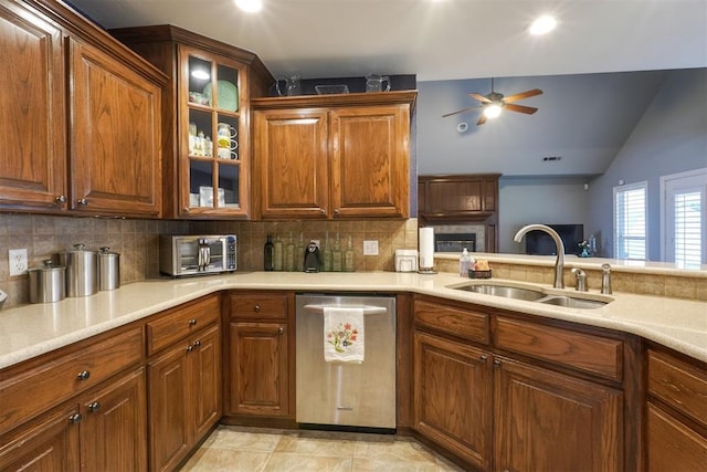 1401 Berkshire Pl, Shawnee, OK 74804 - kitchen featuring dishwasher, a sink, a ceiling fan, decorative backsplash, and light countertops