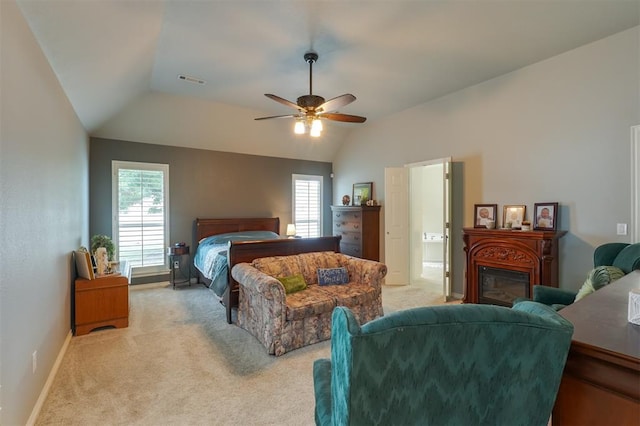 1401 Berkshire Pl, Shawnee, OK 74804 - bedroom featuring light colored carpet, lofted ceiling, a glass covered fireplace, ceiling fan, and baseboards
