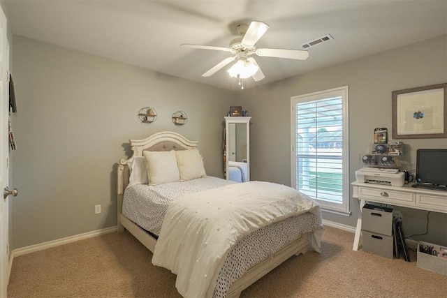 1401 Berkshire Pl, Shawnee, OK 74804 - bedroom featuring light carpet, baseboards, and a ceiling fan