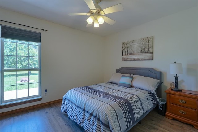 1811 N Bryan St, Shawnee, OK 74804 - bedroom featuring multiple windows, wood finished floors, and baseboards