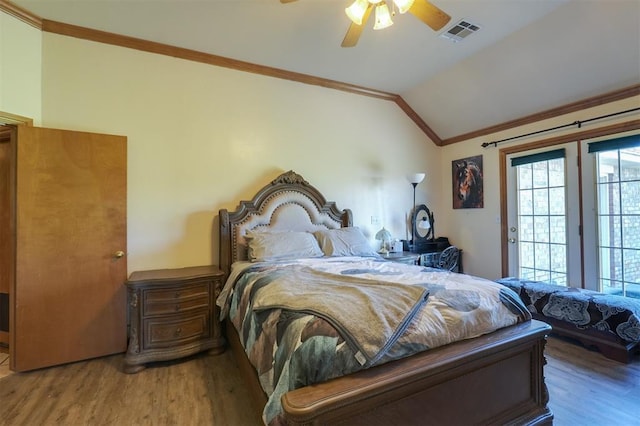 1811 N Bryan St, Shawnee, OK 74804 - bedroom with wood finished floors, lofted ceiling, ornamental molding, access to outside, and a ceiling fan