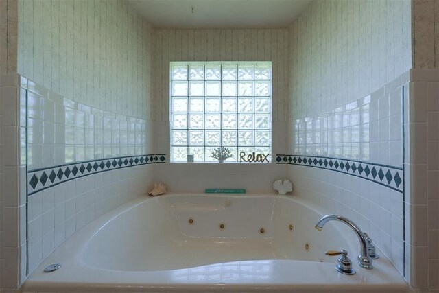 1811 N Bryan St, Shawnee, OK 74804 - bathroom featuring a jetted tub and wallpapered walls