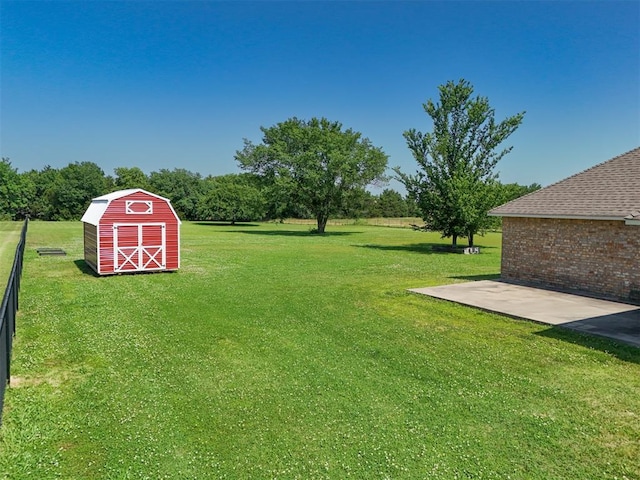 1811 N Bryan St, Shawnee, OK 74804 - view of grassy yard with an outdoor structure and a barn