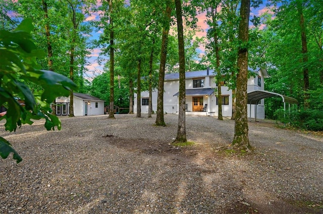 47 White Pine Rd, Broken Bow, OK 74728 - view of front of house featuring driveway and a carport