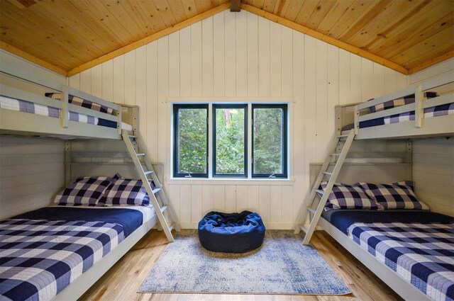 47 White Pine Rd, Broken Bow, OK 74728 - bedroom featuring wood finished floors, vaulted ceiling, wood ceiling, and wooden walls