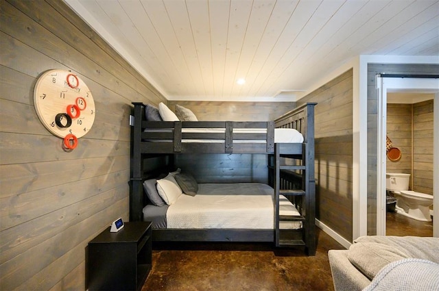 47 White Pine Rd, Broken Bow, OK 74728 - bedroom with wood walls and concrete flooring