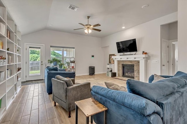 12905 NW 4th St, Yukon, OK 73099 - living room featuring light wood-style floors, ceiling fan, a brick fireplace, lofted ceiling, and recessed lighting