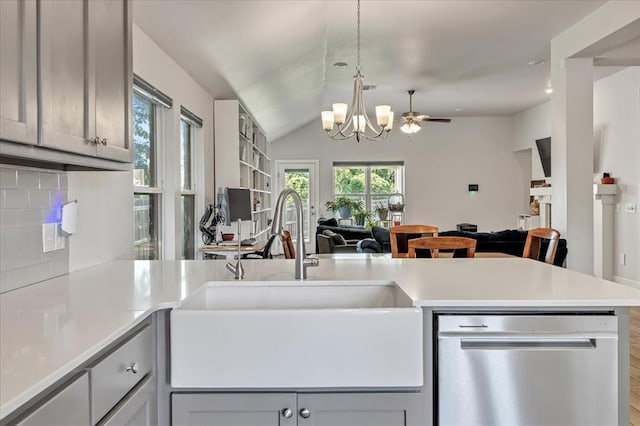 12905 NW 4th St, Yukon, OK 73099 - kitchen with dishwasher, a sink, open floor plan, a chandelier, and light countertops