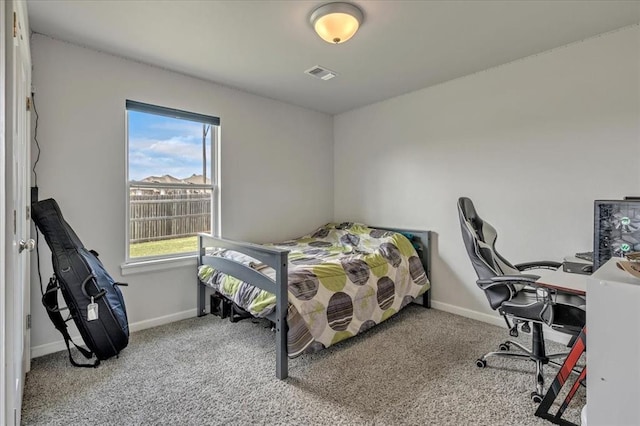 12905 NW 4th St, Yukon, OK 73099 - carpeted bedroom featuring multiple windows, baseboards, and an office area