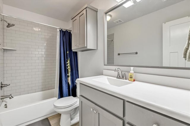 12905 NW 4th St, Yukon, OK 73099 - full bathroom featuring shower / tub combo with curtain, vanity, toilet, and wood finished floors