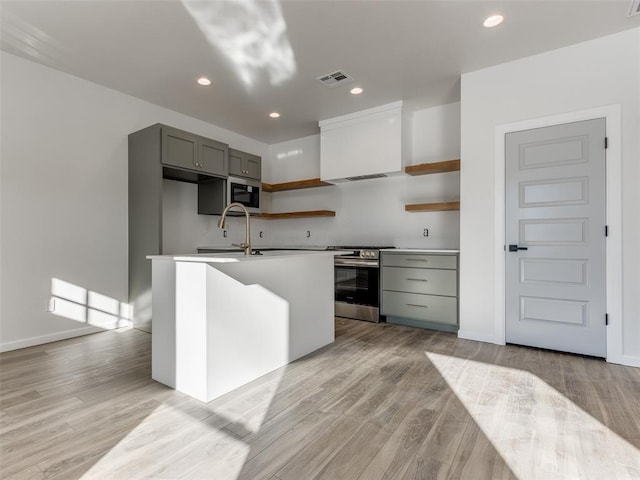 2812 Shoreridge Ave Unit 2814, Norman, OK 73072 - kitchen featuring stainless steel gas stove, open shelves, built in microwave, light wood-type flooring, and recessed lighting