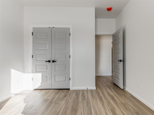 2812 Shoreridge Ave Unit 2814, Norman, OK 73072 - unfurnished room with light wood-style flooring and baseboards