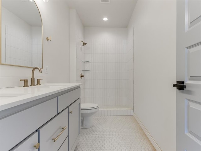 2812 Shoreridge Ave Unit 2814, Norman, OK 73072 - full bathroom featuring double vanity, toilet, tiled shower, tile patterned flooring, and recessed lighting