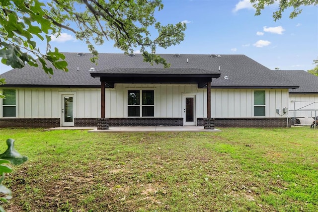 16315 SE 59th St, Choctaw, OK 73020 - rear view of house with a patio area, brick siding, roof with shingles, and board and batten siding