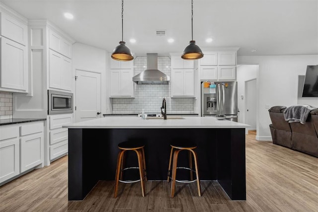 16315 SE 59th St, Choctaw, OK 73020 - kitchen with wall chimney range hood, stainless steel appliances, a sink, backsplash, and open floor plan