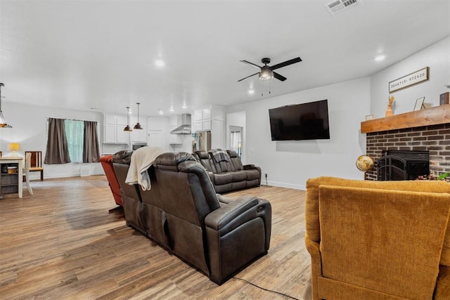 16315 SE 59th St, Choctaw, OK 73020 - living area with a ceiling fan, a brick fireplace, baseboards, recessed lighting, and light wood-type flooring