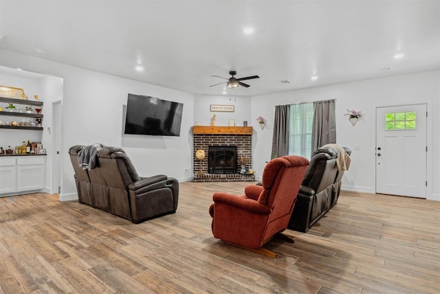 16315 SE 59th St, Choctaw, OK 73020 - living room with a ceiling fan, wood finished floors, recessed lighting, a brick fireplace, and baseboards