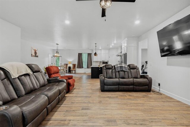 16315 SE 59th St, Choctaw, OK 73020 - living room featuring ceiling fan, light wood finished floors, baseboards, and recessed lighting