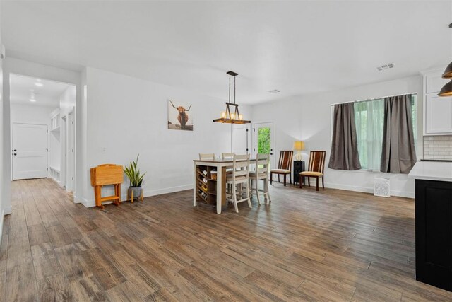 16315 SE 59th St, Choctaw, OK 73020 - dining space with dark wood finished floors, baseboards, and a chandelier