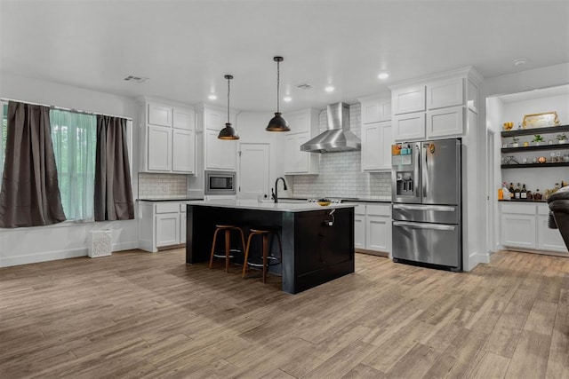 16315 SE 59th St, Choctaw, OK 73020 - kitchen with stainless steel appliances, wall chimney exhaust hood, white cabinetry, tasteful backsplash, and recessed lighting