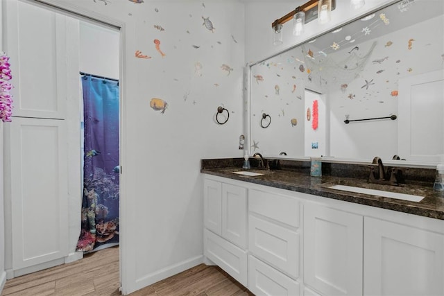 16315 SE 59th St, Choctaw, OK 73020 - bathroom with double vanity, wood finished floors, and baseboards