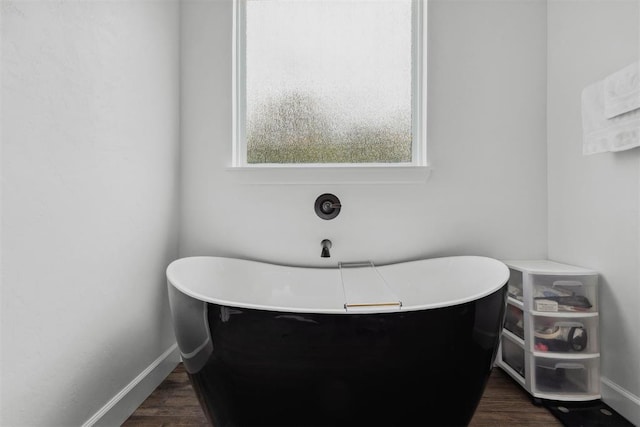 16315 SE 59th St, Choctaw, OK 73020 - full bathroom featuring a freestanding bath, wood finished floors, and baseboards