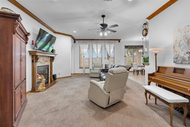 1116 River Birch Dr, Yukon, OK 73099 - living area with ornamental molding, ceiling fan, light carpet, a fireplace with flush hearth, and baseboards