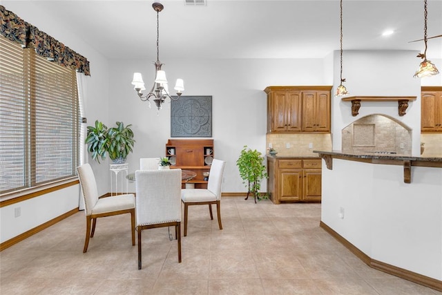 1116 River Birch Dr, Yukon, OK 73099 - dining space featuring a chandelier and baseboards