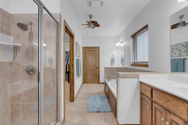 1116 River Birch Dr, Yukon, OK 73099 - bathroom featuring ceiling fan, a shower stall, vanity, a bath, and tile patterned floors