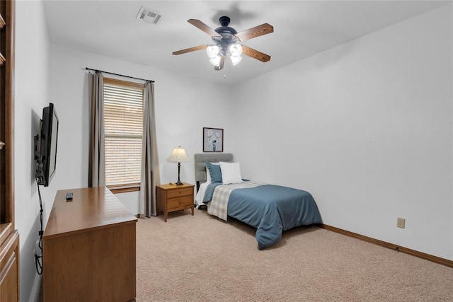 1116 River Birch Dr, Yukon, OK 73099 - bedroom featuring multiple windows, light colored carpet, a ceiling fan, and baseboards