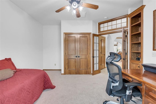 1116 River Birch Dr, Yukon, OK 73099 - bedroom with carpet, an office area, arched walkways, and a ceiling fan