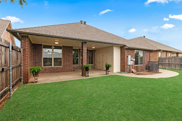 1116 River Birch Dr, Yukon, OK 73099 - rear view of property with brick siding, roof with shingles, and a patio