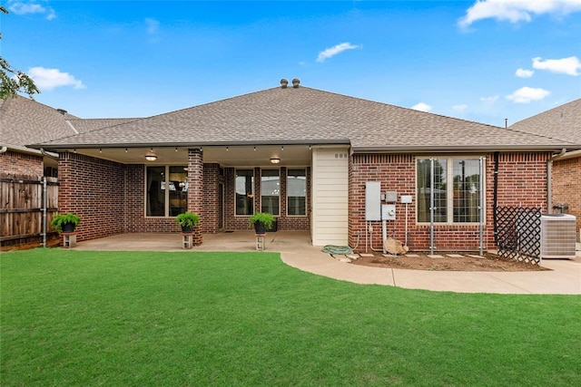 1116 River Birch Dr, Yukon, OK 73099 - rear view of house with brick siding, central air condition unit, a shingled roof, and a patio area
