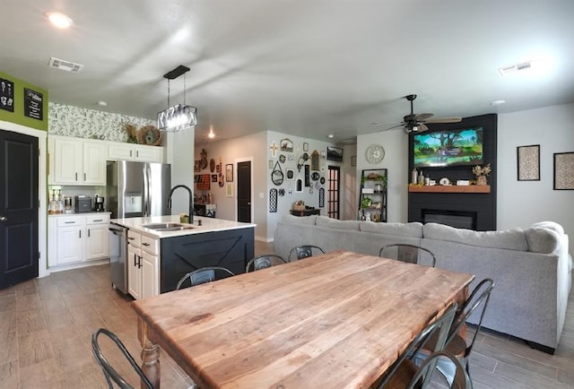 15963 Trail Head Rd, Mcloud, OK 74851 - dining area with wood finished floors and ceiling fan
