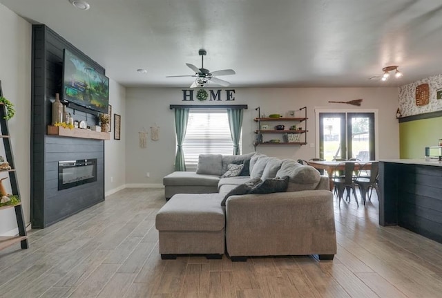 15963 Trail Head Rd, Mcloud, OK 74851 - living area with light wood finished floors, a fireplace, and plenty of natural light