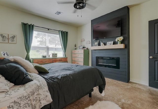 15963 Trail Head Rd, Mcloud, OK 74851 - bedroom featuring a large fireplace and ceiling fan