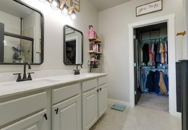 15963 Trail Head Rd, Mcloud, OK 74851 - full bath with double vanity, a shower stall, a spacious closet, and tile patterned floors