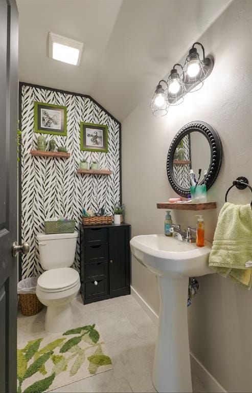 15963 Trail Head Rd, Mcloud, OK 74851 - half bath with vaulted ceiling, toilet, and tile patterned flooring