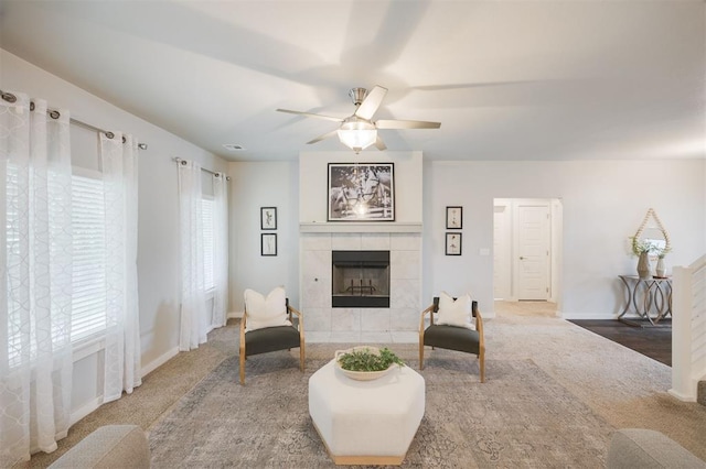 18020 Mounts Farm Rd, Edmond, OK 73012 - living area with a tiled fireplace, plenty of natural light, light colored carpet, and ceiling fan